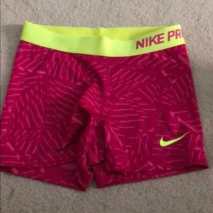 Pink and neon yellow Nike pros